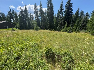 Tucked into a peaceful pocket near Swan Lake, this .67-acre lot - photo 1
