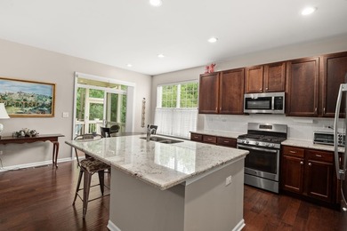 Backing to woods and featuring a screened porch and finished - photo 4
