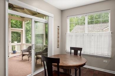 Backing to woods and featuring a screened porch and finished - photo 6
