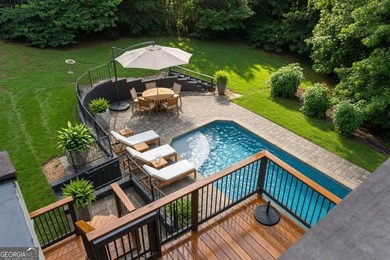 Nestled on a private wooded lot in the highly sought-after - photo 6