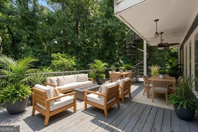 Nestled on a private wooded lot in the highly sought-after - photo 7