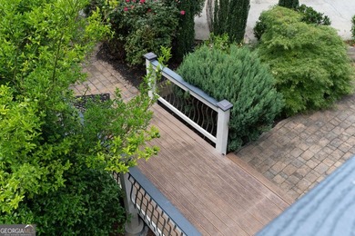 Nestled on a private wooded lot in the highly sought-after - photo 10