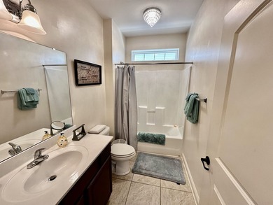 Welcome to this elegant three-bedroom, two-bathroom condominium - photo 12