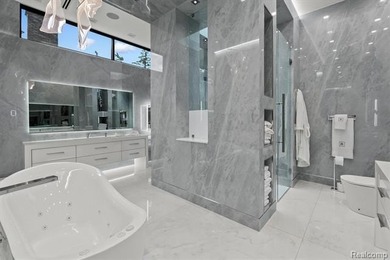 A remarkable expression of contemporary lake-area living, this - photo 25