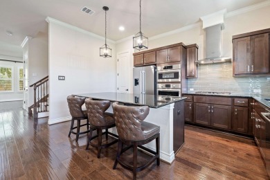 This immaculate 4-story townhome, ideally located on a quiet