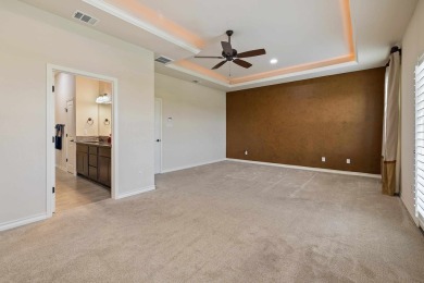 This immaculate 4-story townhome, ideally located on a quiet