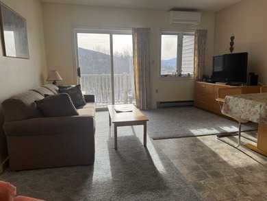 Wake up to front-row views of the South Peak ski slopes and the - photo 10