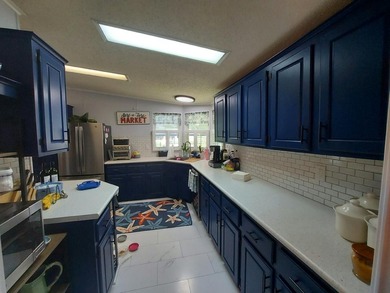 This charming 2-bedroom, 2-bath home features a durable - photo 3