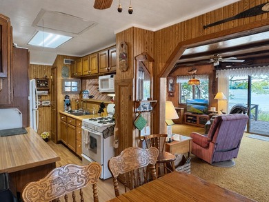 MOTIVATED SELLER - A dollhouse cottage right at the water's edge - photo 12