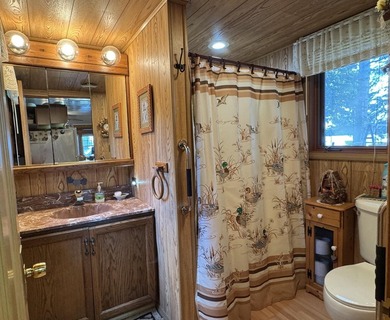 MOTIVATED SELLER - A dollhouse cottage right at the water's edge - photo 19