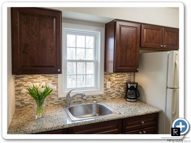 This well-maintained brick two-family home offers an exceptional - photo 12