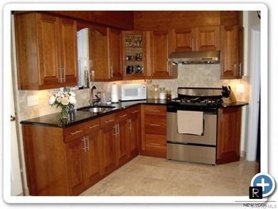 This well-maintained brick two-family home offers an exceptional - photo 22