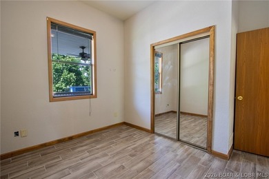 Welcome to this 3-bedroom, 2-bathroom home in Sunrise Beach, MO - photo 11