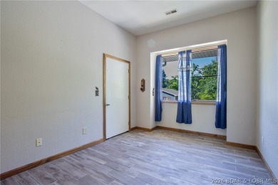 Welcome to this 3-bedroom, 2-bathroom home in Sunrise Beach, MO - photo 15