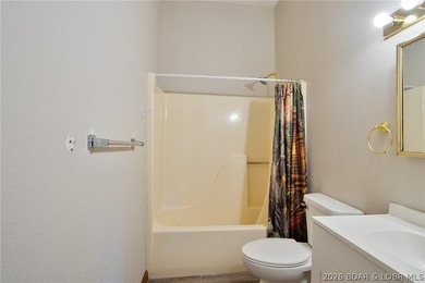 Welcome to this 3-bedroom, 2-bathroom home in Sunrise Beach, MO - photo 16