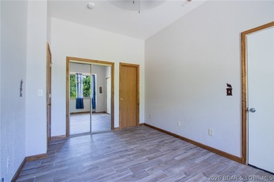 Welcome to this 3-bedroom, 2-bathroom home in Sunrise Beach, MO - photo 18