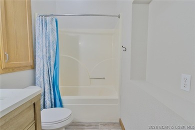 Welcome to this 3-bedroom, 2-bathroom home in Sunrise Beach, MO - photo 19