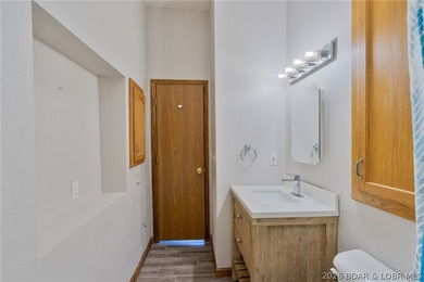 Welcome to this 3-bedroom, 2-bathroom home in Sunrise Beach, MO - photo 20