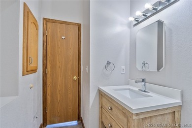 Welcome to this 3-bedroom, 2-bathroom home in Sunrise Beach, MO - photo 21