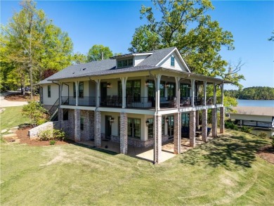 This turnkey, architecturally designed lake home is situated on - Lake Home For Sale in Dadeville, Alabama