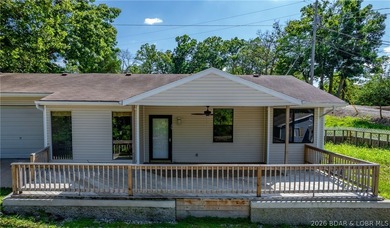 Welcome to this 3-bedroom, 2-bathroom home in Sunrise Beach, MO - photo 22