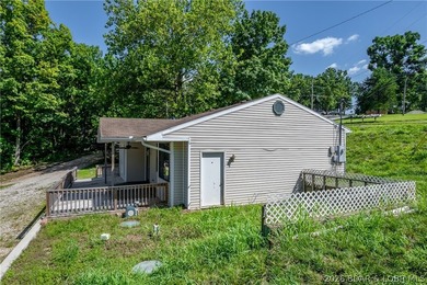 Welcome to this 3-bedroom, 2-bathroom home in Sunrise Beach, MO - photo 23