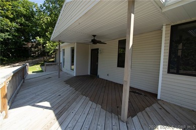 Welcome to this 3-bedroom, 2-bathroom home in Sunrise Beach, MO - photo 24