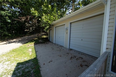 Welcome to this 3-bedroom, 2-bathroom home in Sunrise Beach, MO - photo 25