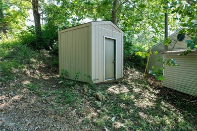 Welcome to this 3-bedroom, 2-bathroom home in Sunrise Beach, MO - photo 26