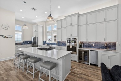 Experience luxury coastal living in this multi-level beach - photo 3