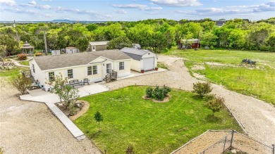 Escape to paradise at this peaceful retreat nestled on approx 1 - Lake Home For Sale in Granbury, Texas