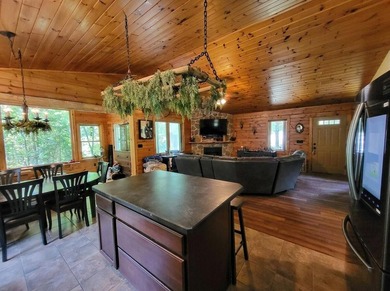 This 3-bedroom, 2-full-bath home in Wilmington, NY sits on a - photo 11
