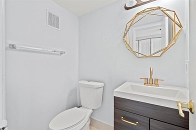 Beautifully Updated Ground Floor Unit. 1 Bedroom, 1 1/2 Baths - photo 12