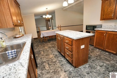 Enjoy lake living in this spacious 4 bedroom, 2 bath home - photo 24