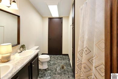 Enjoy lake living in this spacious 4 bedroom, 2 bath home - photo 28