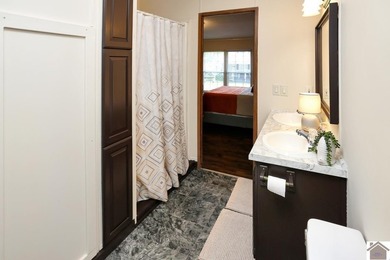 Enjoy lake living in this spacious 4 bedroom, 2 bath home - photo 29
