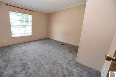 Enjoy lake living in this spacious 4 bedroom, 2 bath home - photo 35