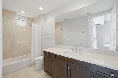 Welcome to an expansive fourth-floor residence in Seaglass at