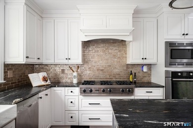 Beautifully updated 4/5 bedroom 4 1/2 bath residence offering a - photo 9