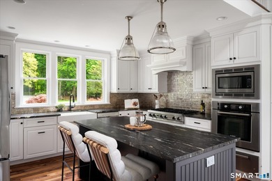 Beautifully updated 4/5 bedroom 4 1/2 bath residence offering a - photo 10