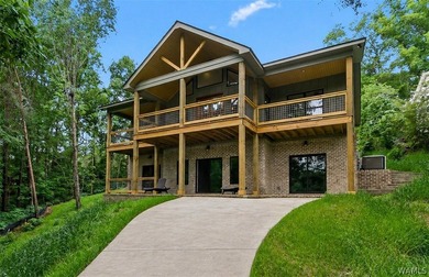 Experience lakefront luxury in this stunning new construction on - photo 1