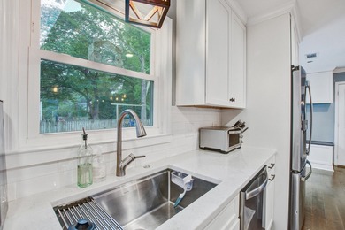 Lovingly updated with a fresh coastal-inspired aesthetic, this - photo 13
