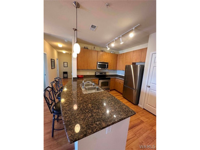Top floor condo with awesome view of the city & retail area! - photo 1