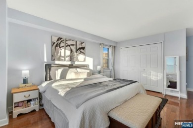 Live above it all in this 21st-floor corner residence with