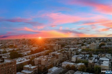 Live above it all in this 21st-floor corner residence with