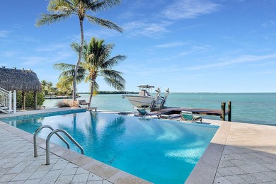Welcome to 166 Bayview Drive, a rare bayfront estate in the - photo 32
