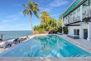 Welcome to 166 Bayview Drive, a rare bayfront estate in the - photo 33