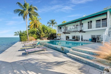 Welcome to 166 Bayview Drive, a rare bayfront estate in the - photo 36
