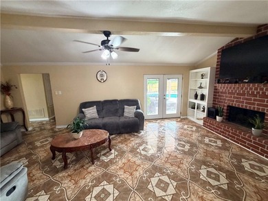 Step into this inviting 4 bedroom, 2 bath home tucked away on a - photo 2