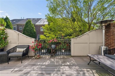 Set behind the gates of One Ivy Walk, this brick townhome offers - photo 18